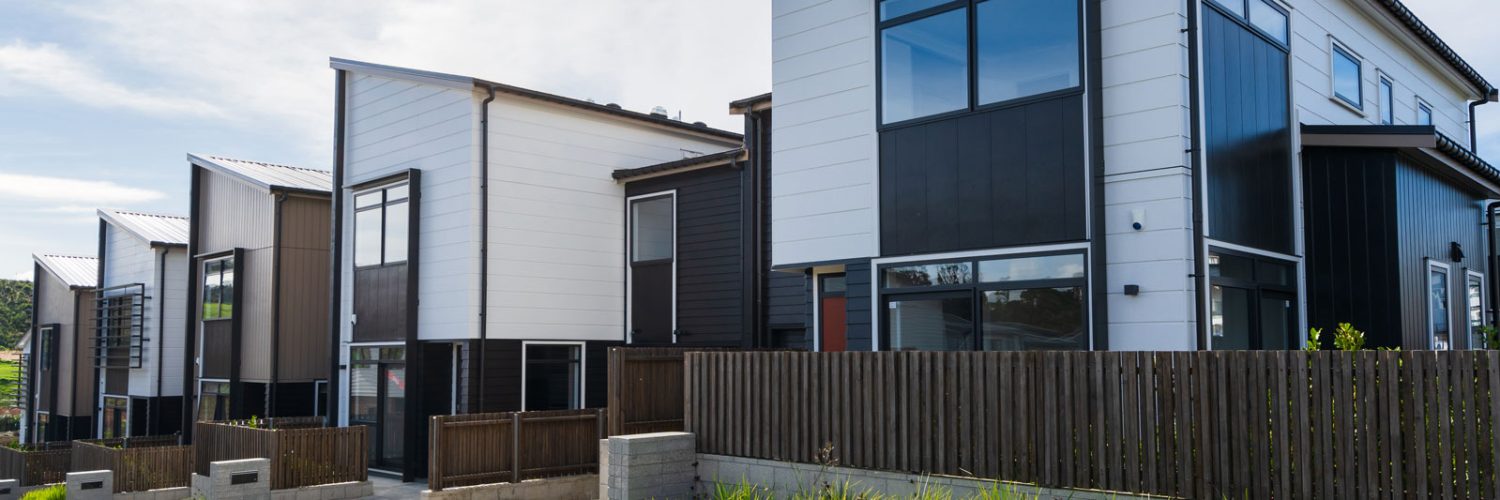 Photo showing the outside of painted townhouses in Auckland, New Zealand